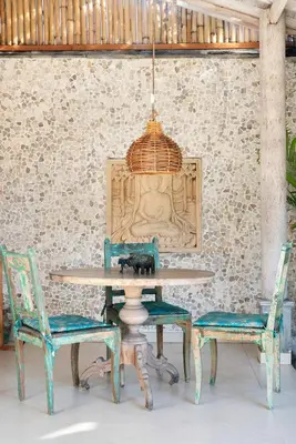 a table with two chairs and a lamp at Villa Aisis Seminyak in Seminyak