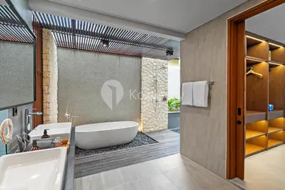 a bathroom with a bath tub and a sink at Sewana Villa by Kozystay - Natadesa Resort in Jimbaran