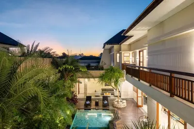 an aerial view of a house with a swimming pool at Villa Ellyne Canggu by Nagisa Bali in Canggu