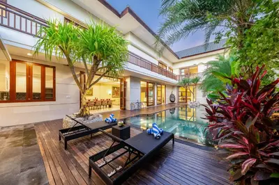 an indoor swimming pool in a villa at Villa Ellyne Canggu by Nagisa Bali in Canggu