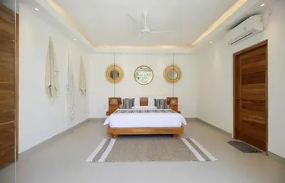 a bedroom with a bed and a ceiling at NEW 4 BDR Villa Rooftop & pool Seminyak Petitenget in Seminyak