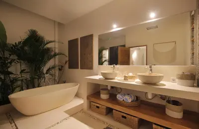a bathroom with two sinks and a large mirror at NEW 4 BDR Villa Rooftop & pool Seminyak Petitenget in Seminyak