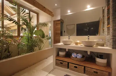 a bathroom with two sinks and a large mirror at NEW 4 BDR Villa Rooftop & pool Seminyak Petitenget in Seminyak