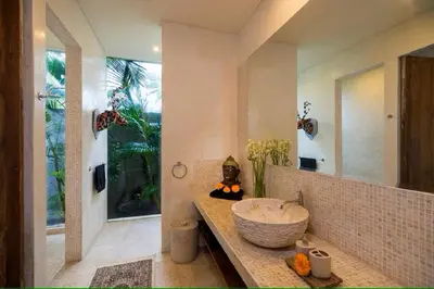 a bathroom with a bowl sink and a mirror at Tropical Villa Batik - Large Garden & Pool, Concierge! 3mins to Beach, Clubs, Cafes in Seminyak