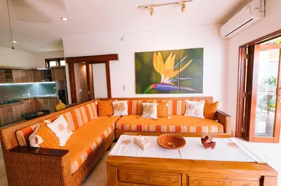 a living room with a couch and a table at Villa Leona Seminyak in Seminyak