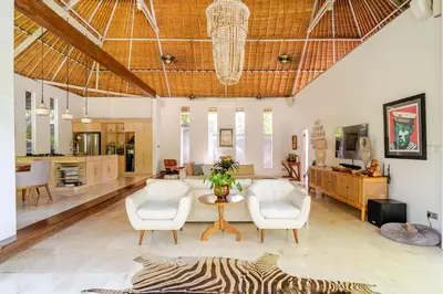 a living room with a zebra rug on the floor at Villa Bliss Umalas in Kerobokan