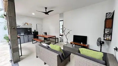 a living room with a couch and a table at Ulun Kubu Villa in Kerobokan