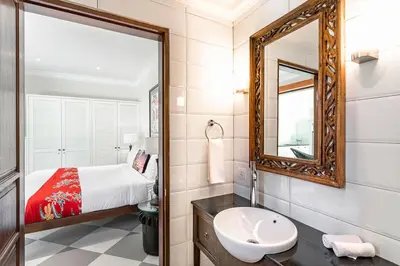 a bathroom with a bed and a mirror and a sink at Beautiful 1 bedroom villa in perfect location in Seminyak