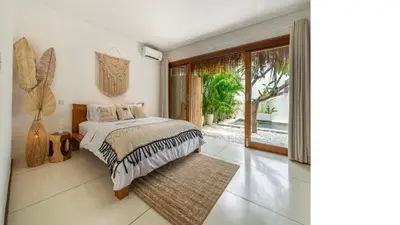 a bedroom with a bed and a large window at 2min Beach, Atlas, Finns Canggu in Canggu