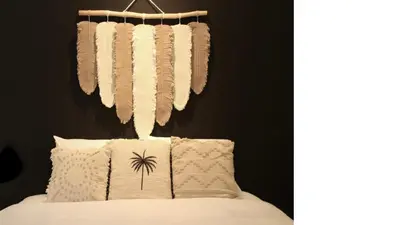 a bedroom with a bed with pillows and a black wall at 2min Beach, Atlas, Finns Canggu in Canggu
