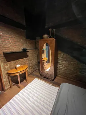 a room with a mirror and a table and a chair at 1 BR Cozy Apartment in center of Seminyak in Seminyak
