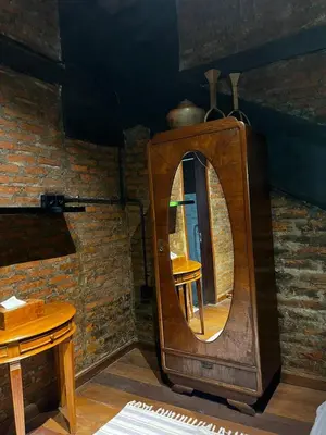a wooden mirror in a room with a table at 1 BR Cozy Apartment in center of Seminyak in Seminyak
