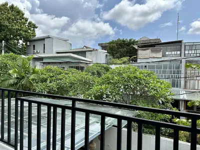 a balcony with a view of a building at Spring Villa Nusa Dua in Nusa Dua