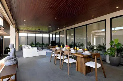 a dining room with a table and chairs at D'Padi Villa Canggu in Canggu