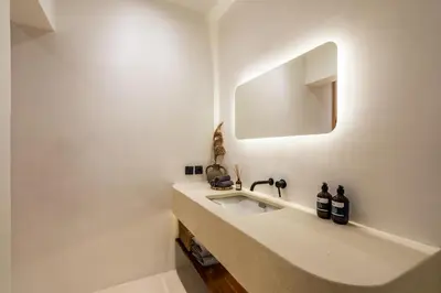 a bathroom with a sink and a mirror at Casa Nalani in Kerobokan