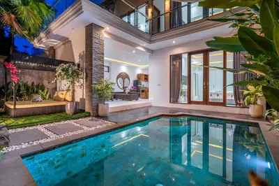 an indoor swimming pool in a house at Villa Bima by JB Villas in Seminyak