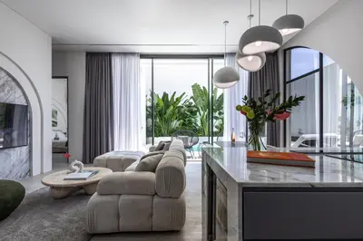 a living room with a couch and a table at Brand New Luxury 5 Stars Designer Villa by Amare Villas in Kerobokan
