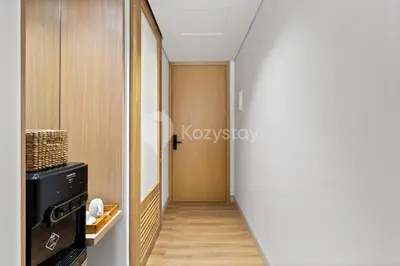 a hallway with a door leading to a room at Calira by Kozystay - Nusa Dua in Nusa Dua