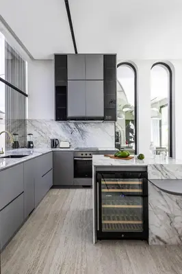 a kitchen with white and black appliances and marble counters at Brand New Luxury5 Stars Designer By Villa Amare Villa 3 in Kerobokan