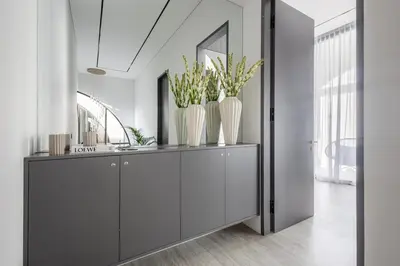 a bathroom with two white vases on a cabinet at Brand New Luxury5 Stars Designer By Villa-Amare Villa 5 in Kerobokan