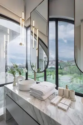 a bathroom with a sink and a large window at Brand New Luxury5 Stars Designer By Villa-Amare Villa 5 in Kerobokan