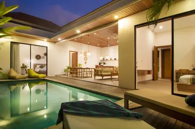 a house with a swimming pool and a living room at LaBumbak 01 - 2BR Villa Escape in Umalas with Private Pool in Canggu