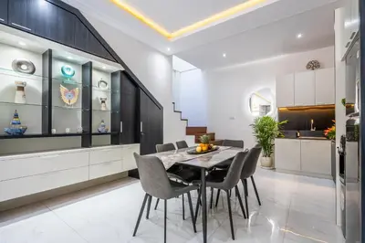 a dining room with a table and chairs at Villa Shinta by JB Villas in Seminyak