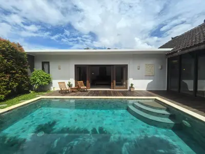 a swimming pool in the backyard of a house at Villa Veyla Seminyak 10 mins walk to beach in Seminyak