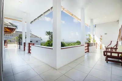 a large room with white walls and large windows at Villa Langit Ocean View Jimbaran in Jimbaran
