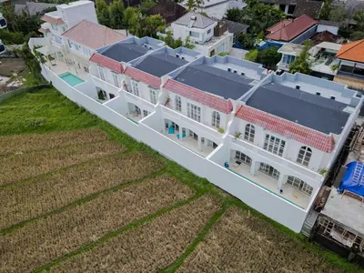 an aerial view of a large white building at Brand New 4BR Colonial Retreat in Berawa, Canggu in Canggu