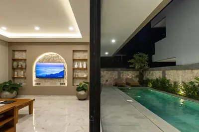 a swimming pool in a house with a house at Sandat Villa 123 in Canggu