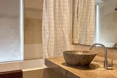 a bathroom with a sink and a tub at Green Leaf Villa - 1 Bedroom pool Villa with Minimum Stay 2 Nights in Nusa Dua