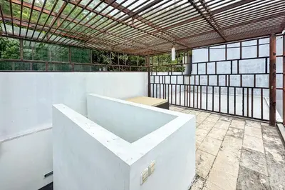 an outdoor patio with a wooden pergola at Green Leaf Villa - 1 Bedroom pool Villa with Minimum Stay 2 Nights in Nusa Dua
