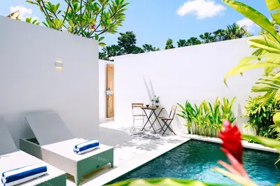 a swimming pool in the backyard of a villa at Abby May - Top location near Potato Head, walk everywhere! in Seminyak