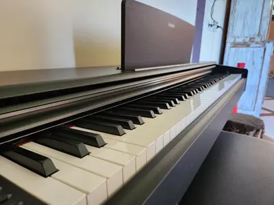 a piano keyboard with the top of it at Serai House 2BR Cozy Kerobokan Home in Kerobokan