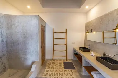 a bathroom with a sink and a mirror at Villa Java by DreamAwayBali in Seminyak