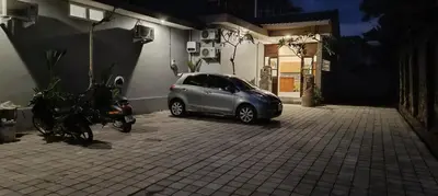 a small silver car parked in a parking lot at Kubunaku Sanur Bali in Sanur