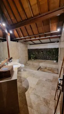 a large bathroom with two sinks and a tub at 2 Minutes Walk to the Beach 3BR Retreat Villa in Canggu