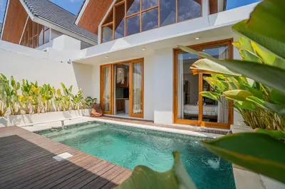 a swimming pool in front of a villa at Sunrise Oasis - 2BR Villa in Kerobokan in Kerobokan
