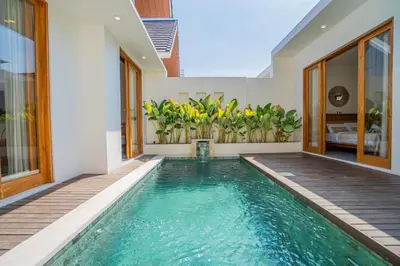 a swimming pool in the middle of a house at Sunrise Oasis - 2BR Villa in Kerobokan in Kerobokan