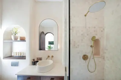 a bathroom with a sink and a shower at Villa Benteke Umalas in Kerobokan
