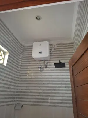 a bathroom with a white box on the ceiling at Ayoolasudi in Kerobokan