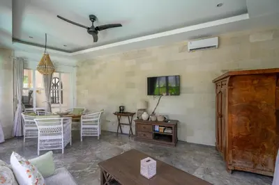 a living room with a couch and a table at 2BR Villa walking distance to Finns & Atlas in Canggu