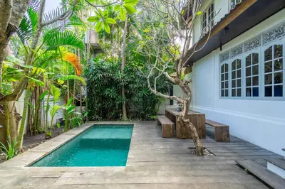 a small swimming pool with a bench and a house at 2BR Villa in Umalas next to Seminyak & Canggu in Kerobokan