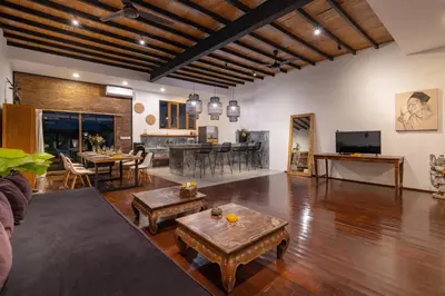 a living room with a couch and a table at Villa Wampu By DreamAwayBali in Seminyak