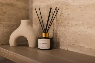 a candle and a vase sitting on a shelf at CAVO Villa in Seminyak