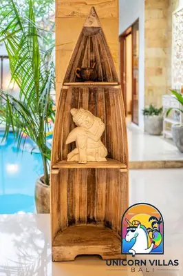 a wooden cat house with a cat statue at A&R4 Villa - by Unicorn Villas Bali in Seminyak