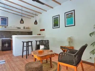 a living room with chairs and a table at Villa Pastis Umalas #2, near Canggu in Canggu