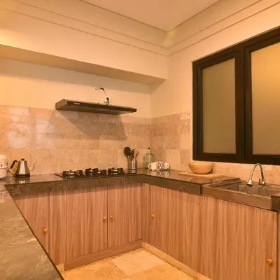 a kitchen with a sink and a counter top at Villa EL Noya Umallas in Badung