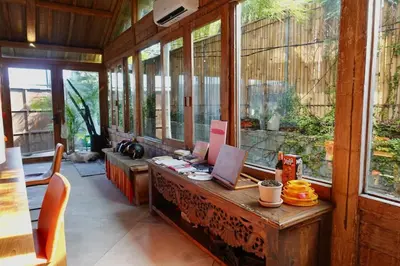 a room with a desk with a laptop on it at Spacious Family Home & Office Canggu, stay with cats in Canggu
